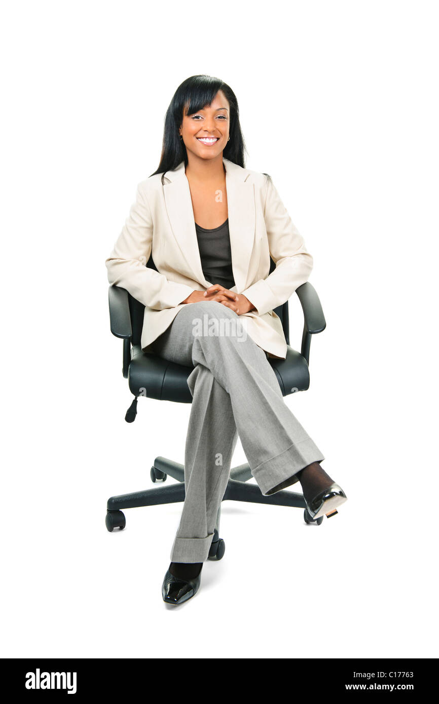 Young smiling black woman business manager sitting in leather office