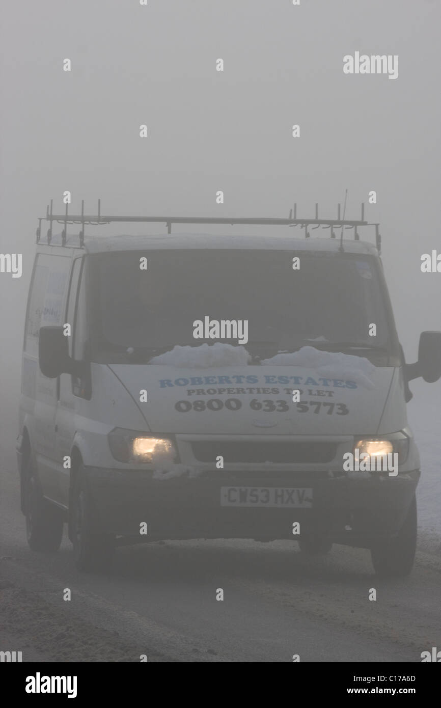 Traffic in freezing fog and heavy snow Stock Photo Alamy