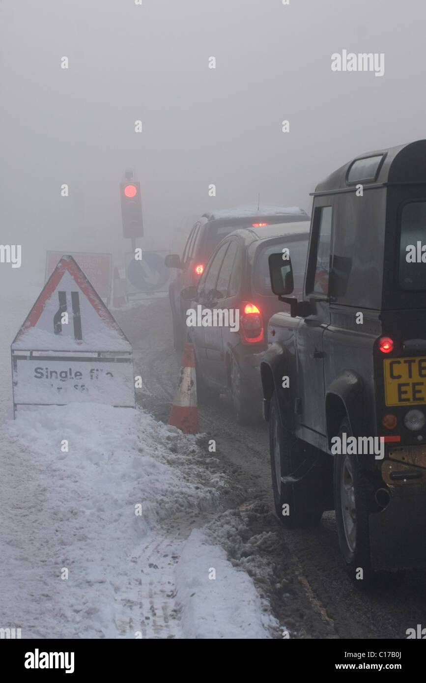 Roadworks in the snow hi-res stock photography and images - Alamy