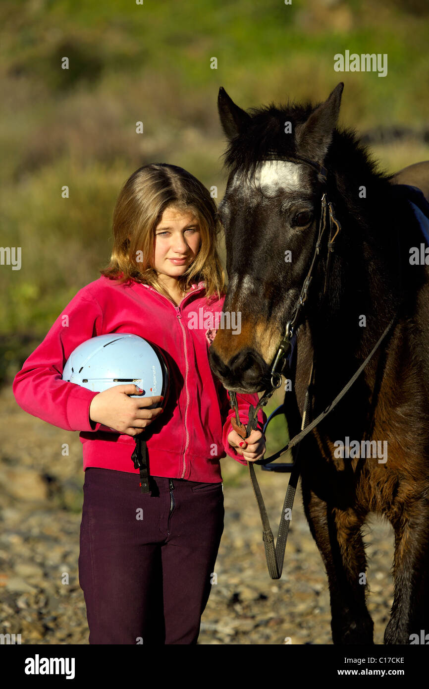 Young teenage English girl with her pony, teenager, 13, 14, 15, year, years, old, person, female, pony, ponies, small, horse, Stock Photo