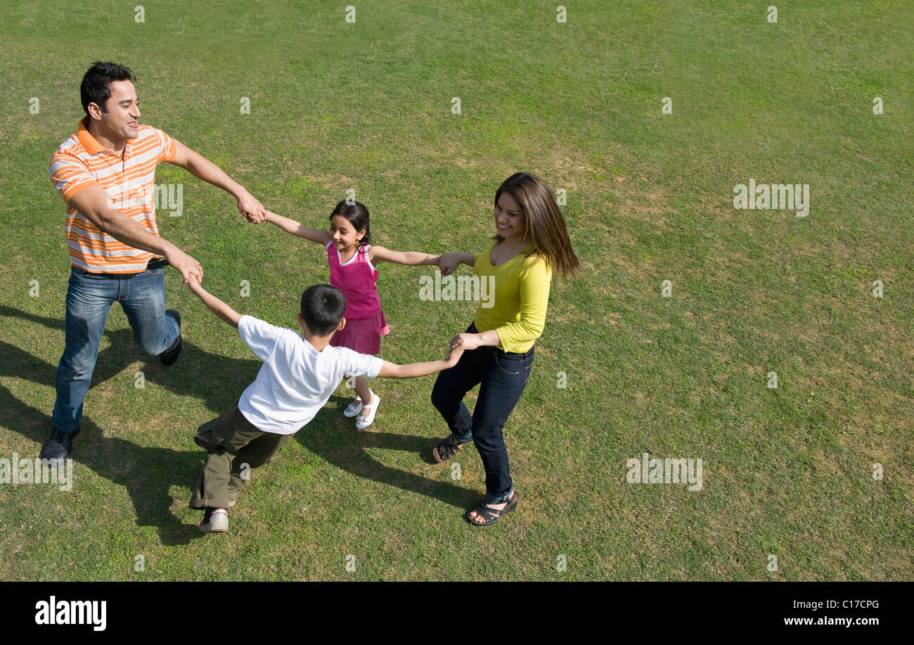 Family playing in a park Stock Photo - Alamy