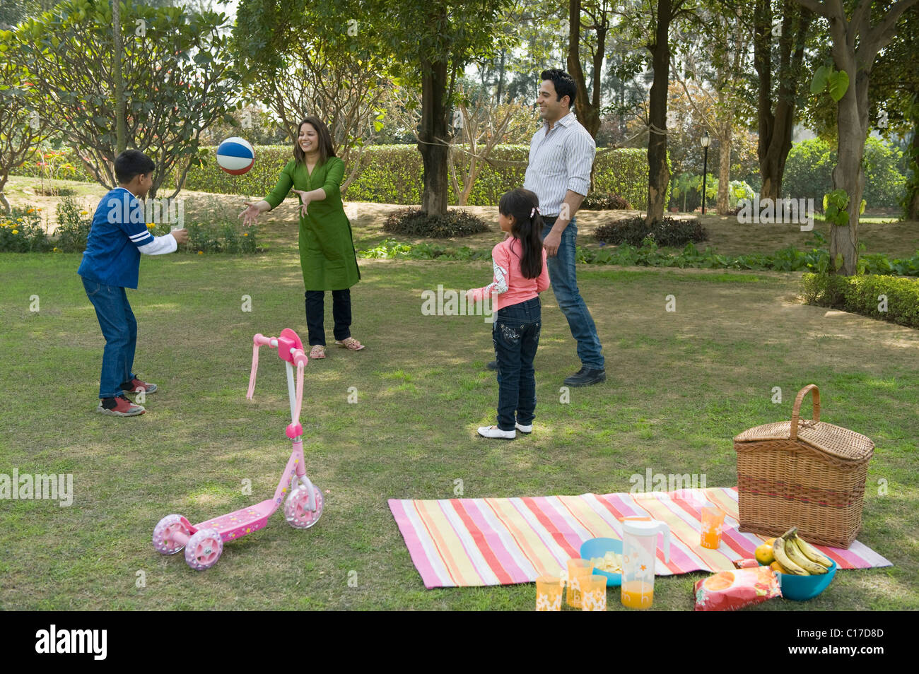 Family playing basketball in a park Stock Photo - Alamy