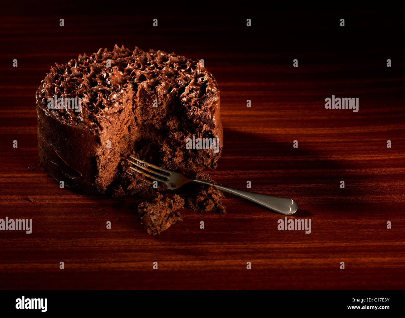Luscious dark chocolate cake on a retro style background Stock Photo