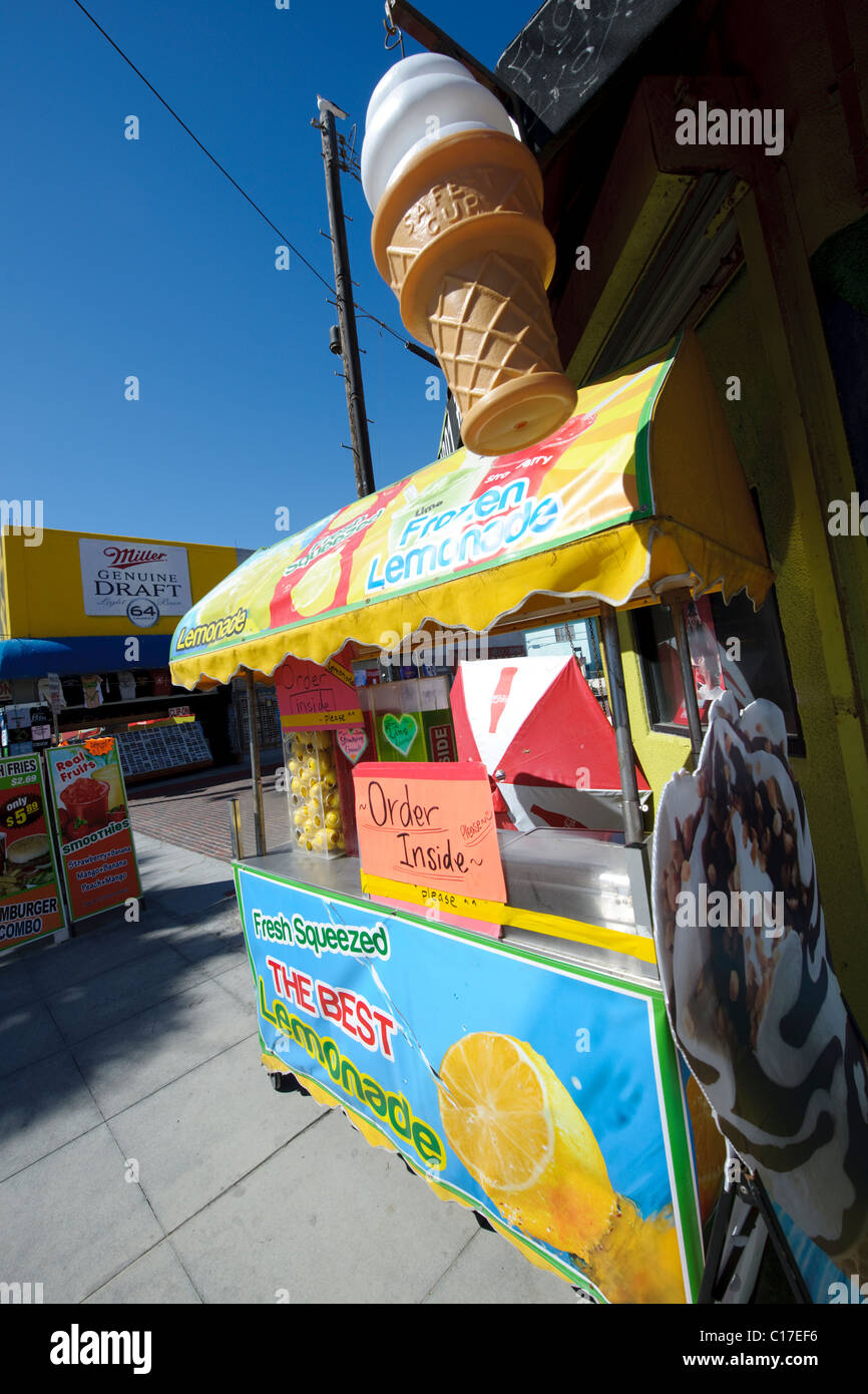 lemonade stand cart in market place in california selling drinks and snacks with blue sky with giant ice cream cone in the roof Stock Photo