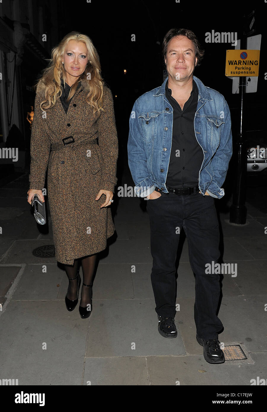 Caprice Bourret and a male companion leaving Beach Blanket Babylon, in