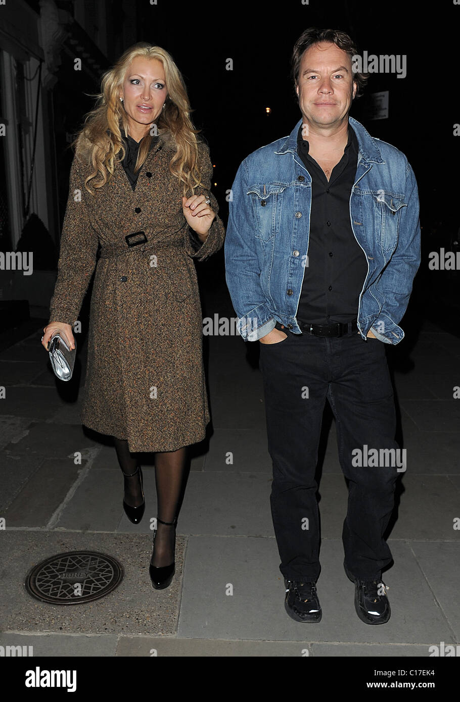 Caprice Bourret and a male companion leaving Beach Blanket Babylon, in