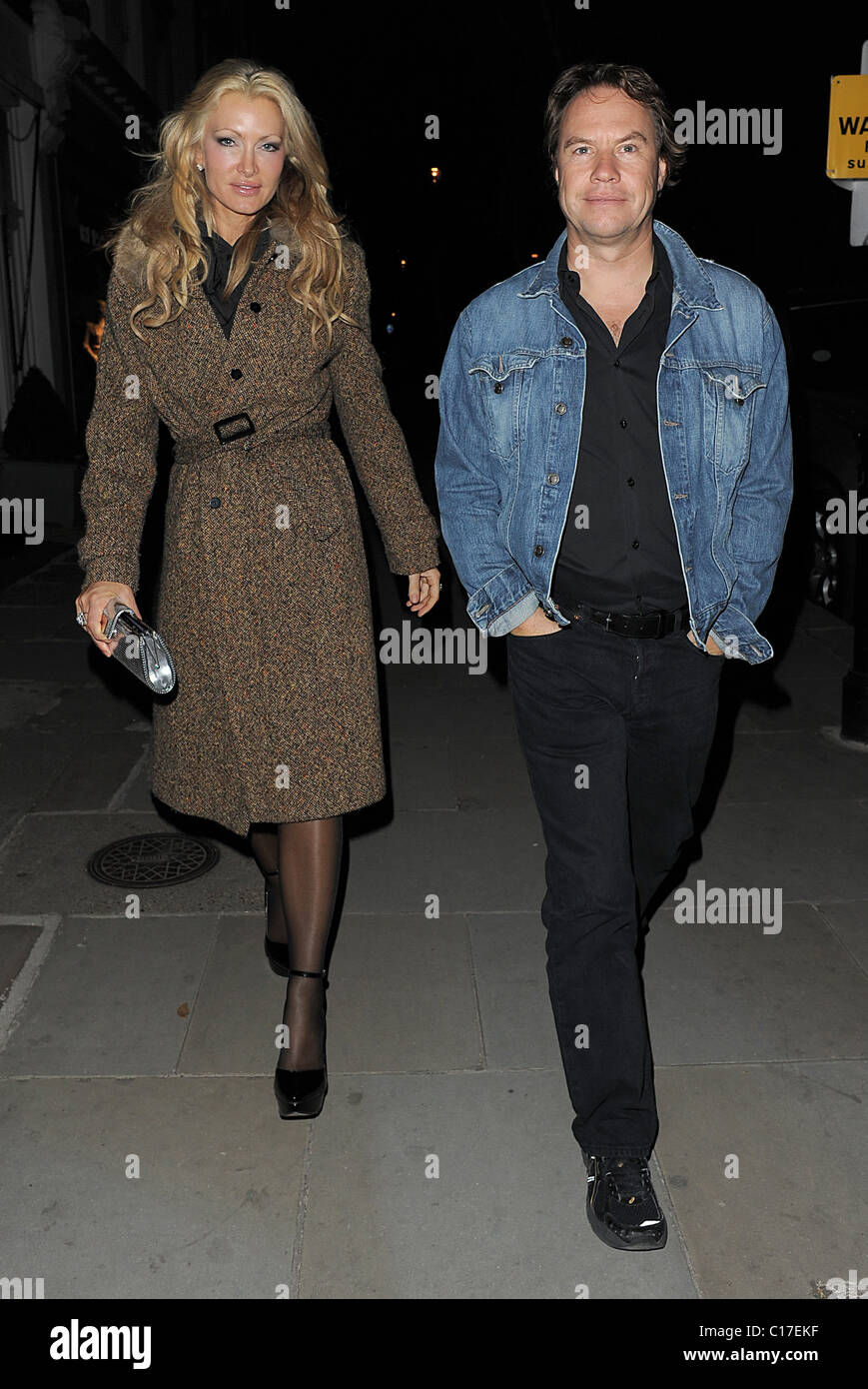 Caprice Bourret and a male companion leaving Beach Blanket Babylon, in