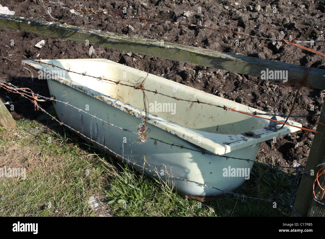 Bathtub placed in countryside and used as spring water trough, exilles,  Italy Stock Photo - Alamy