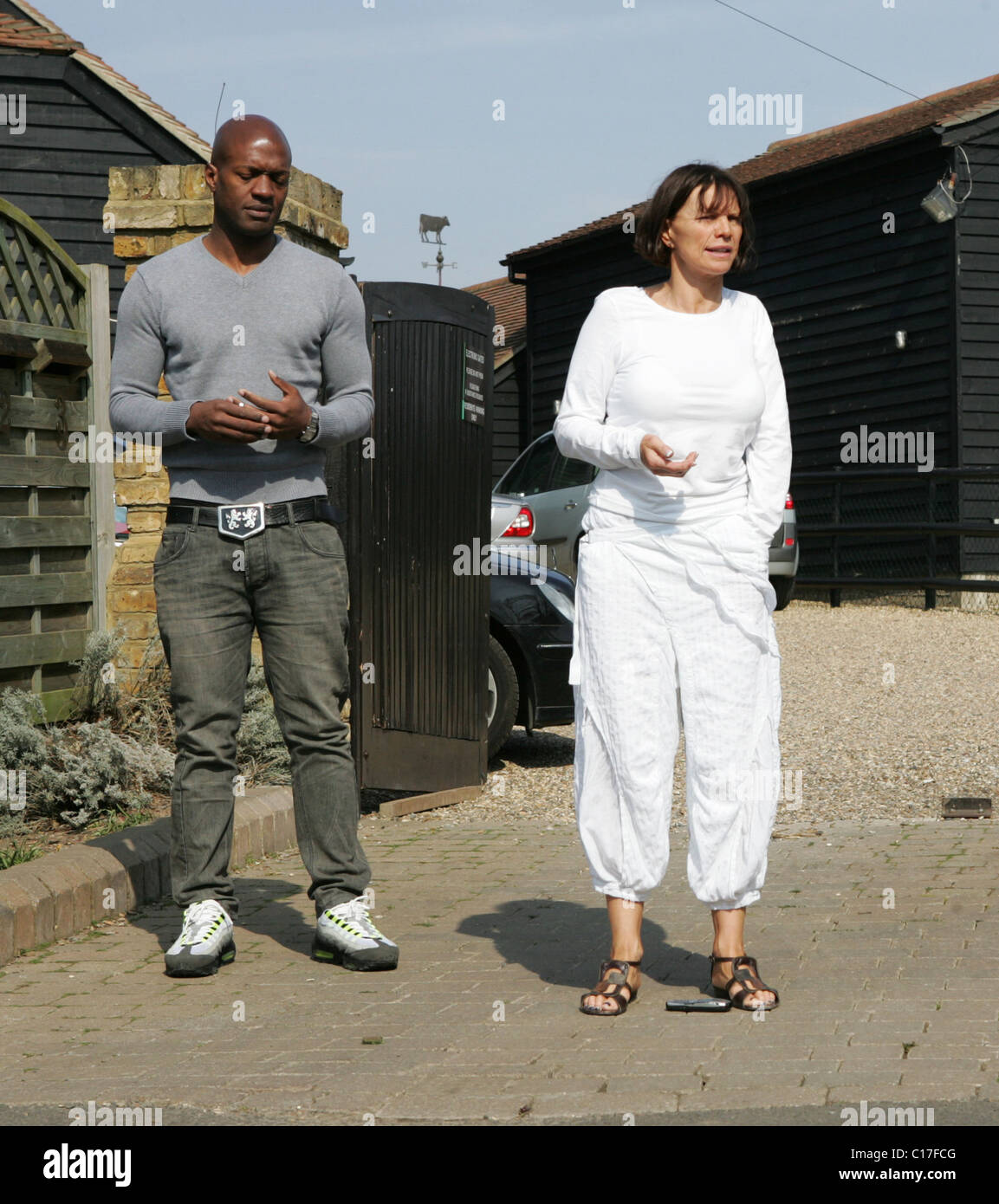 Kevin Adams and Jackiey Budden talk to the press gathered outside Jade Goody's house on March 20, 2009. Jackiey told the Stock Photo