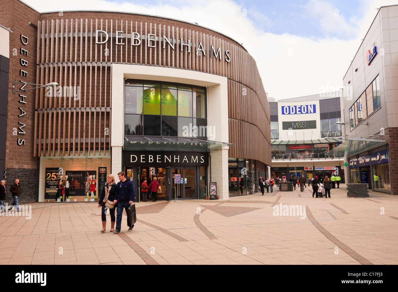 Debenhams department store at Eagles Meadow shopping centre with people shoppers in the precinct. Wrexham, Flintshire, North Wales, UK, Britain Stock Photo