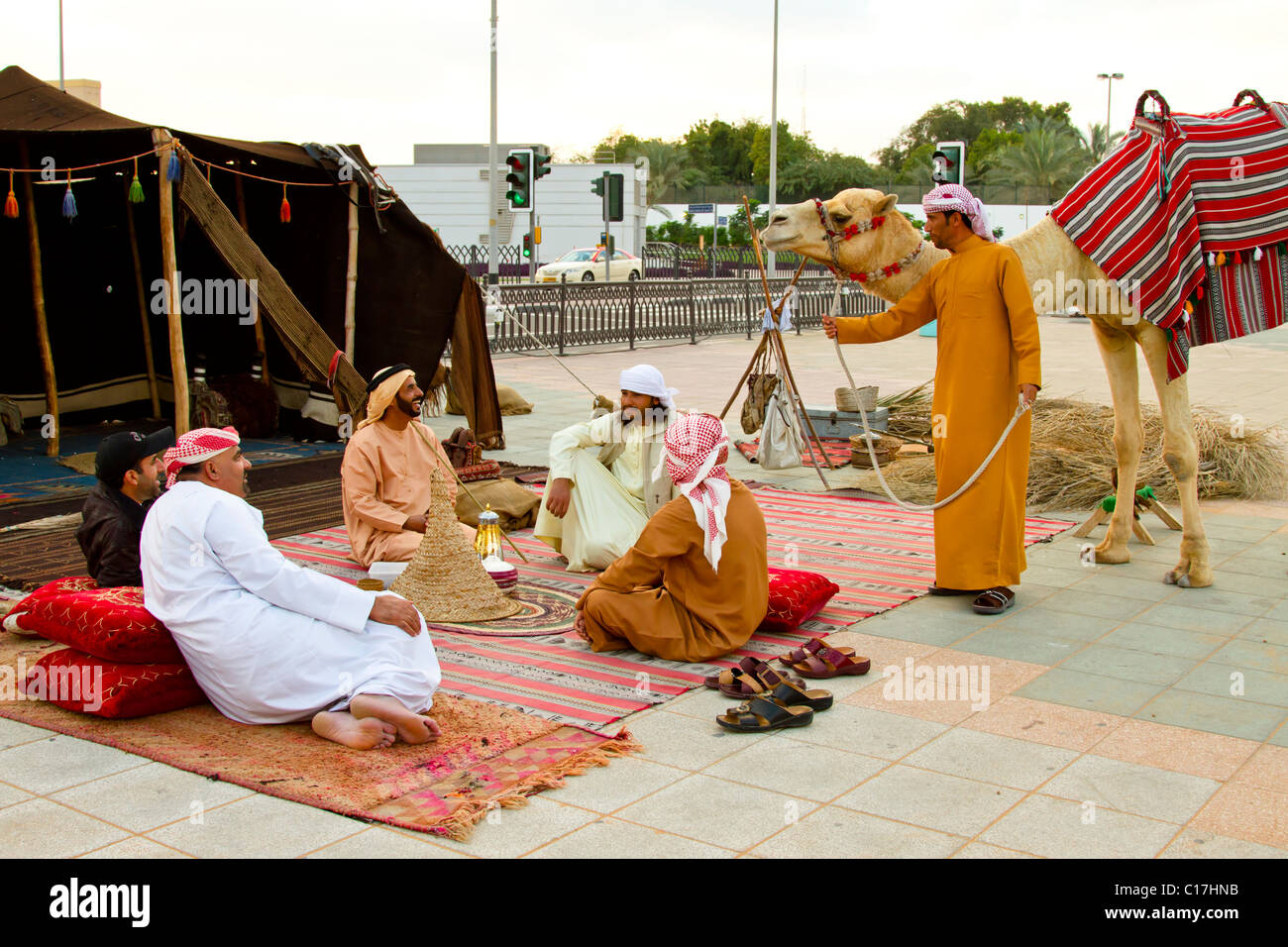 Arab men in traditional dress at a camp along Dubai Creek in Dubai, UAE