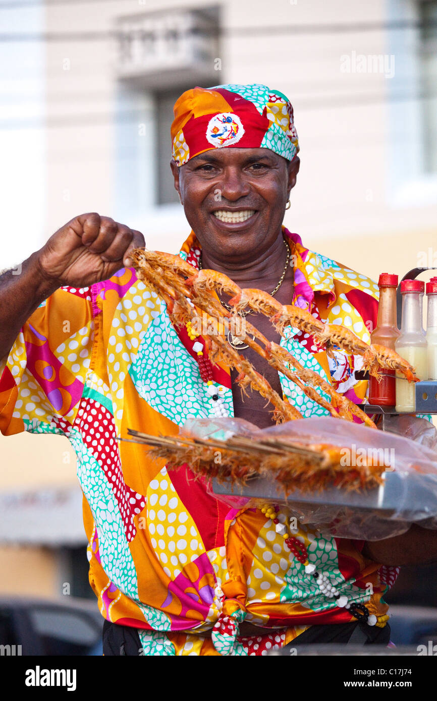 Shrimp skewers vendor on Barra Beach, Salvador, Brazil Stock Photo