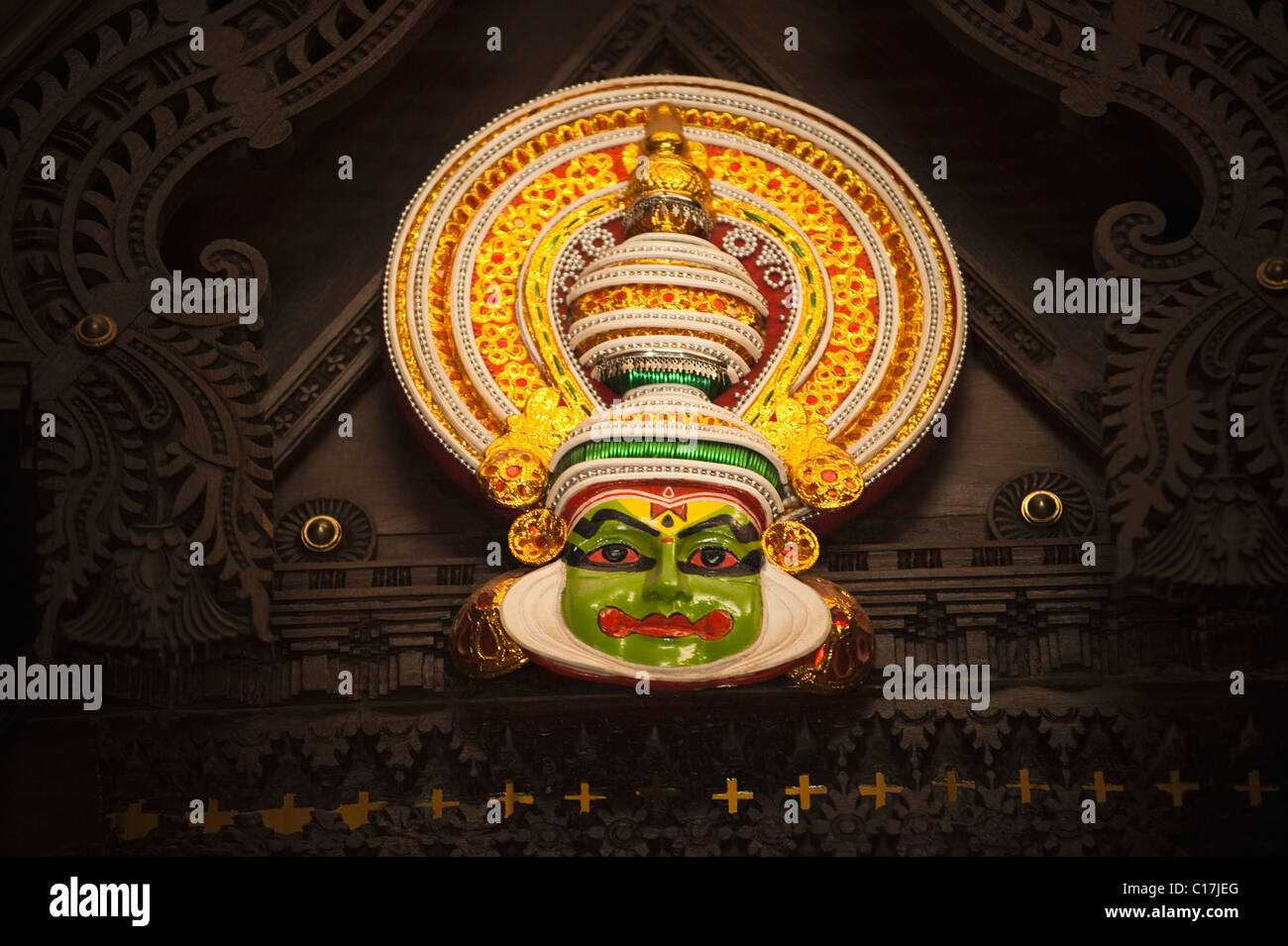 Kathakali mask hanging with a wooden frame, Kochi, Kerala, India Stock