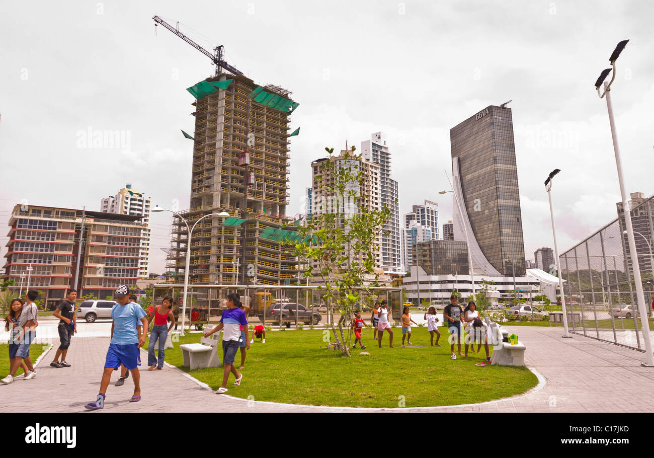 PANAMA CITY, PANAMA - People in park and skyscrapers on Balboa Avenue. Stock Photo