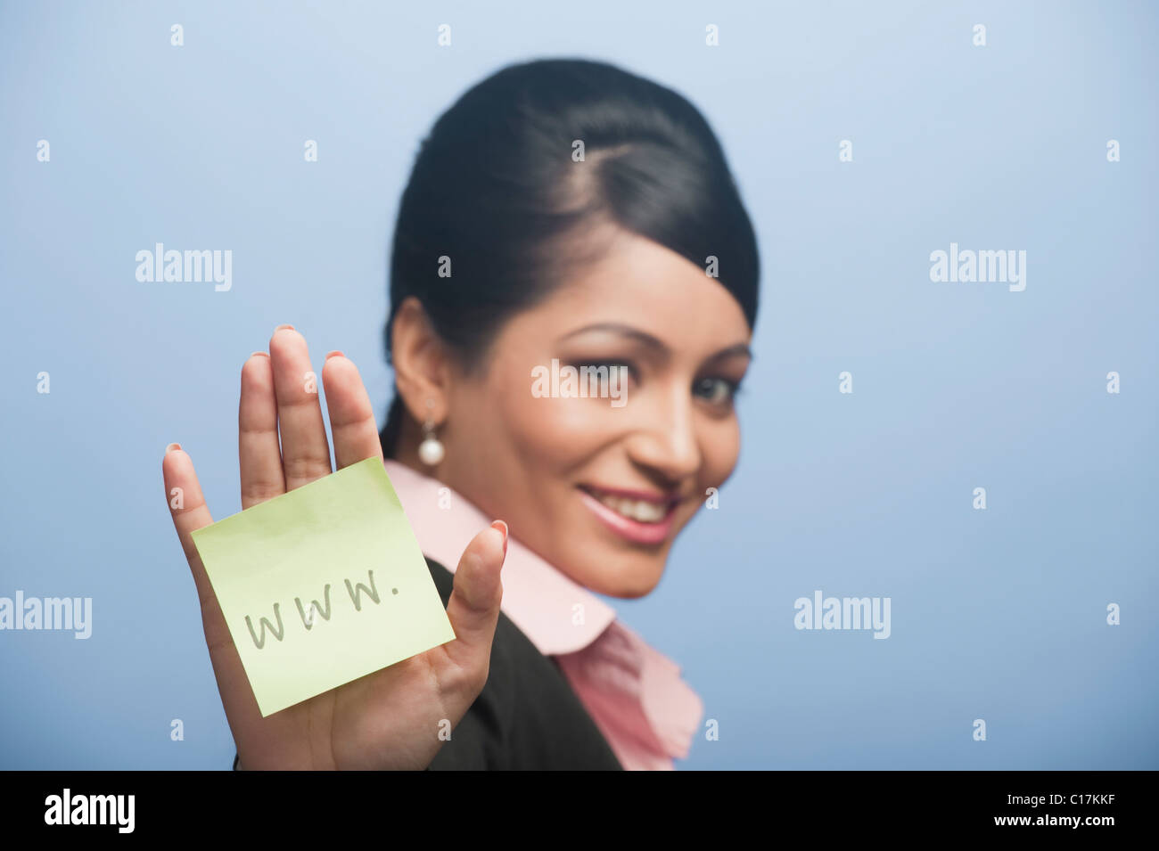 Woman showing her palm with adhesive note stuck on it Stock Photo