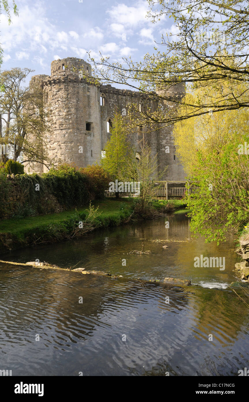 Nunney Castle, from across the Nunney Brook, in the village of Nunney, Somerset, England Stock Photo