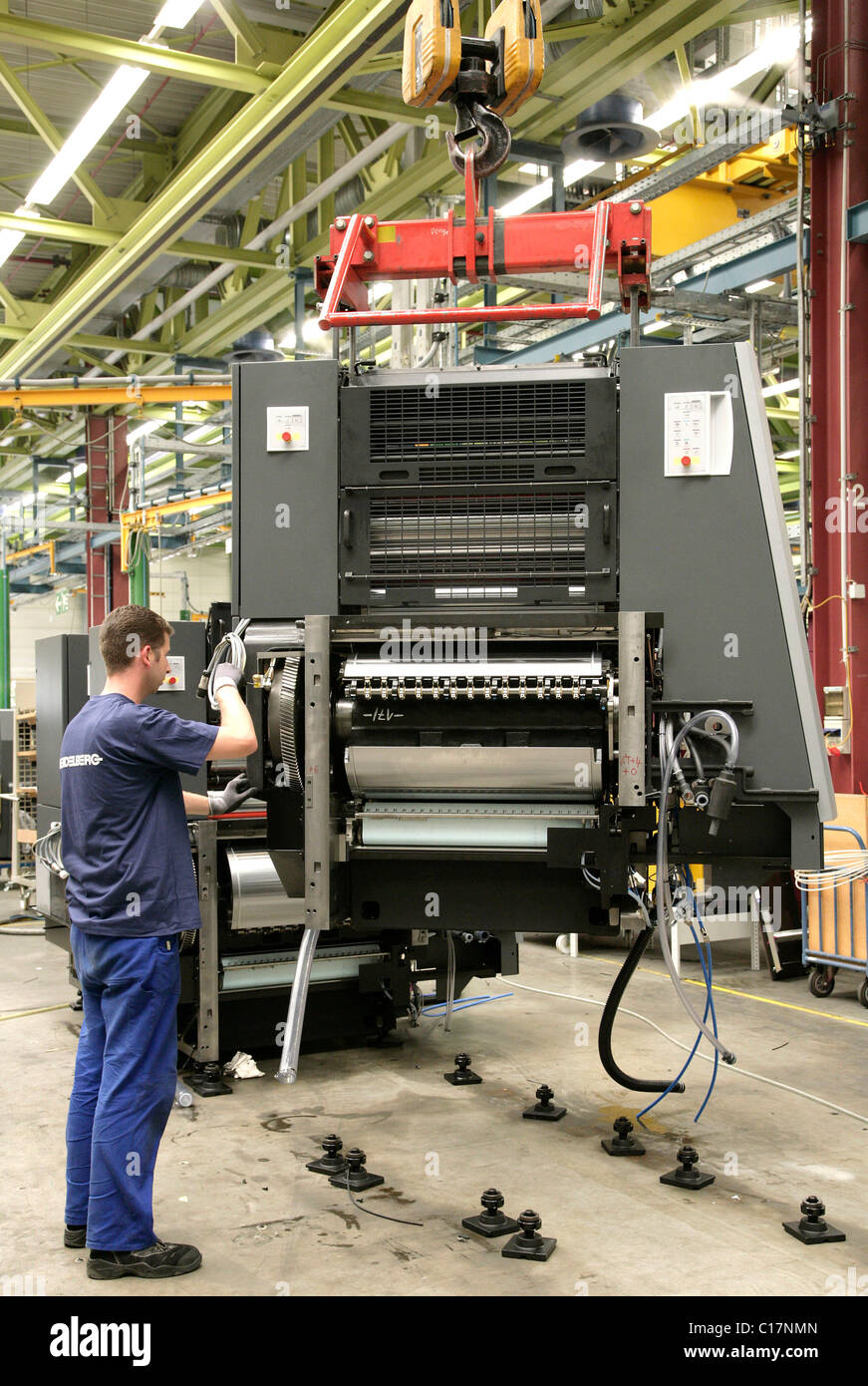 Employee heidelberger druckmaschinen ag dismantling hires stock