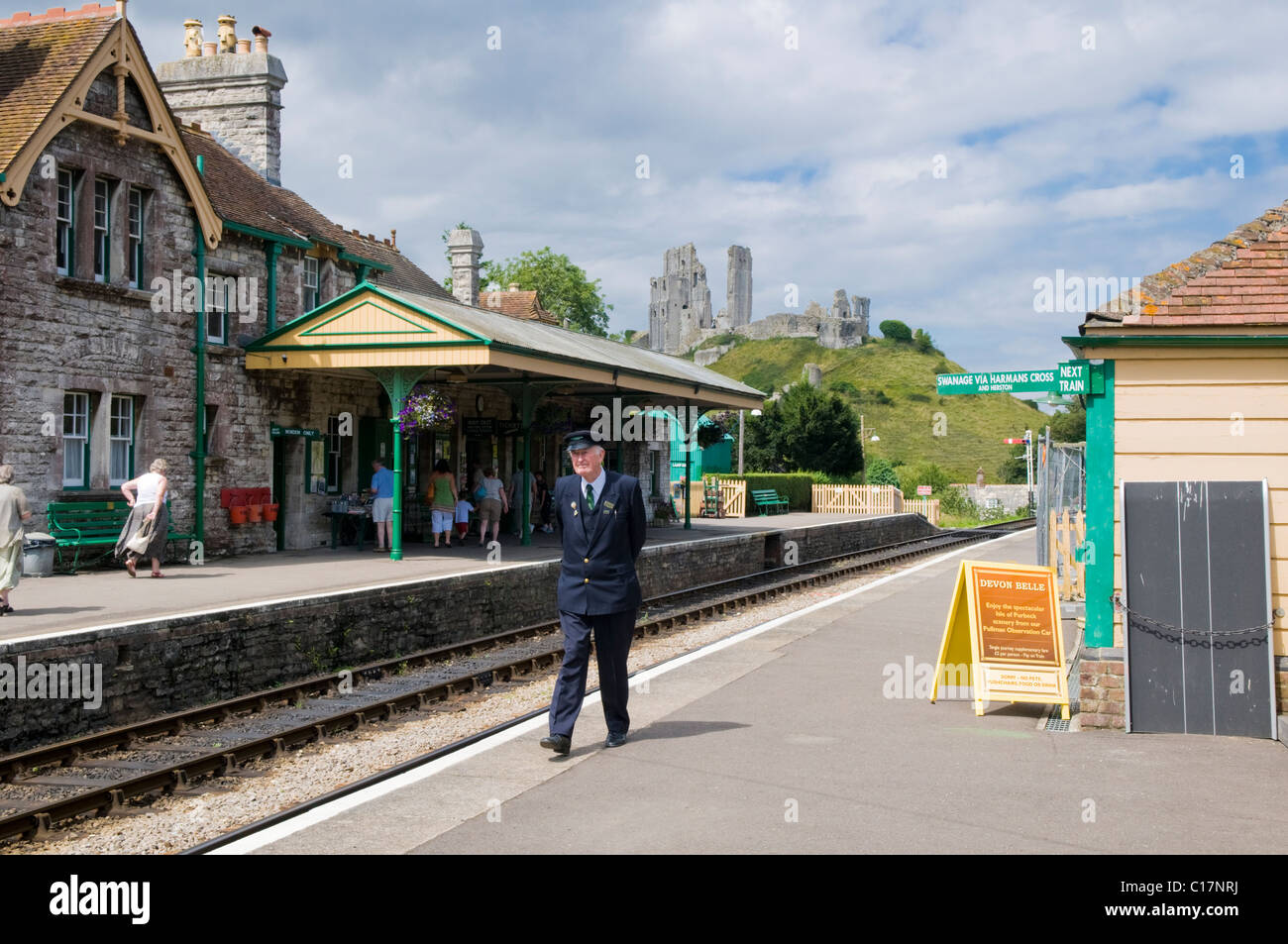 Station Master on the Platform at Corfe Castle Station, a vintage steam railway in Dorset, UK Stock Photo