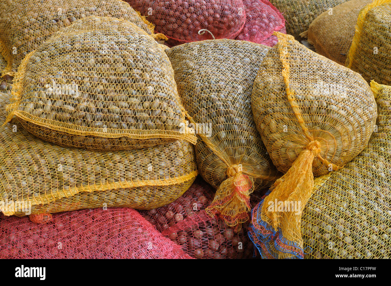 Stacked nets filled with with feed for game Stock Photo