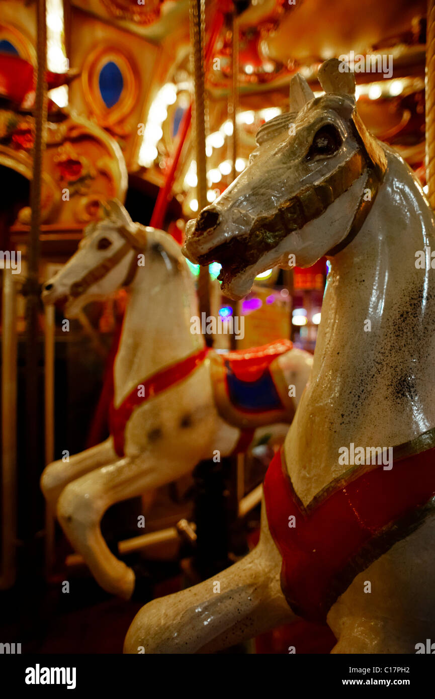 Horses on a children's merry-go-round by night at Wiener Prater, Vienna, Austria, Europe Stock Photo