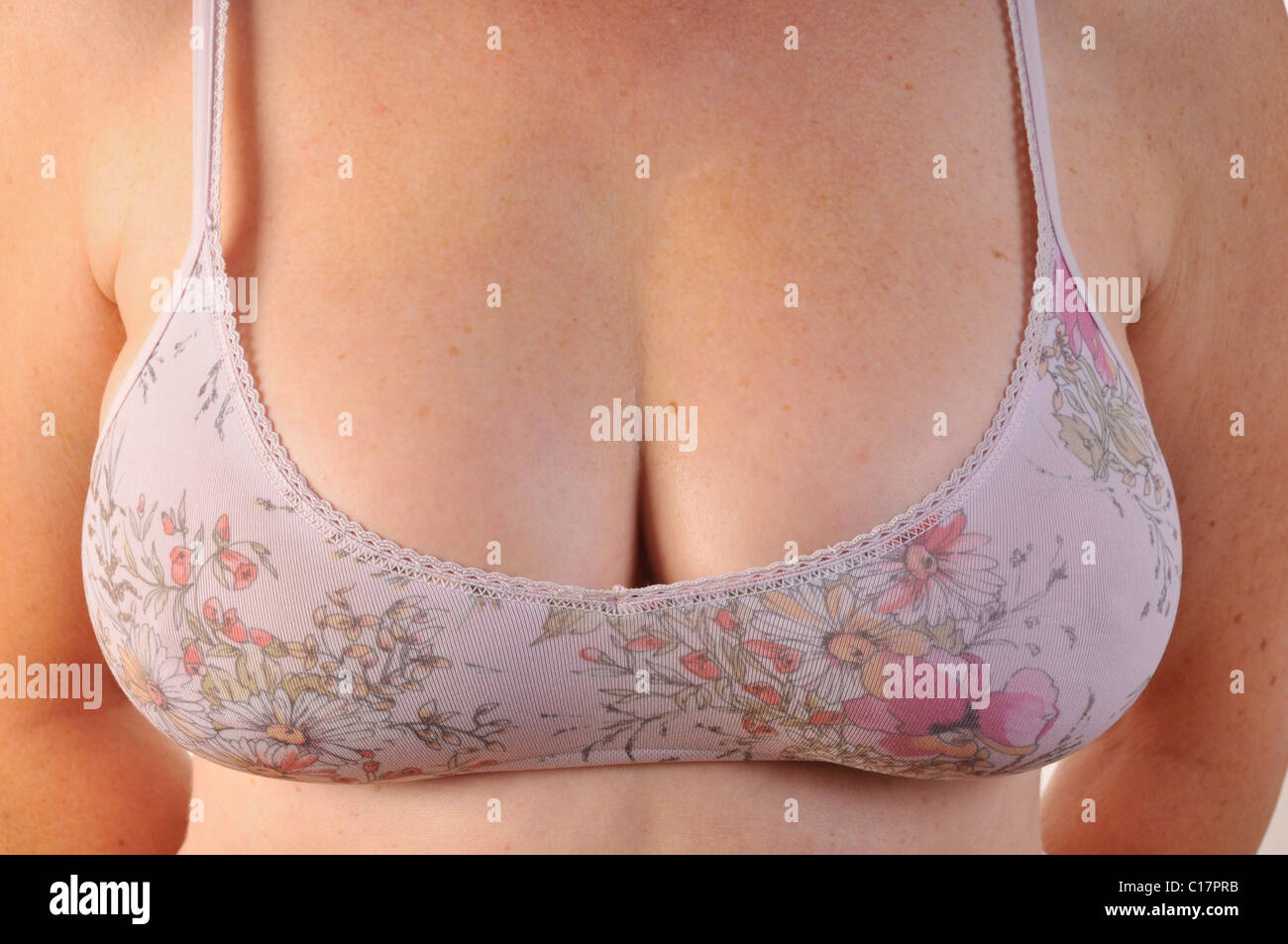 Woman wearing a badly fitting, too small bra Stock Photo - Alamy
