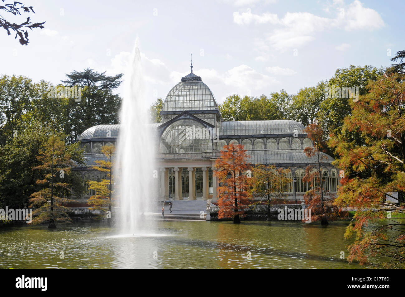Fountain in a lake in front of a crystal palace, Palacio de Cristal, Retiro, Park, Madrid, Spain, Europe Stock Photo