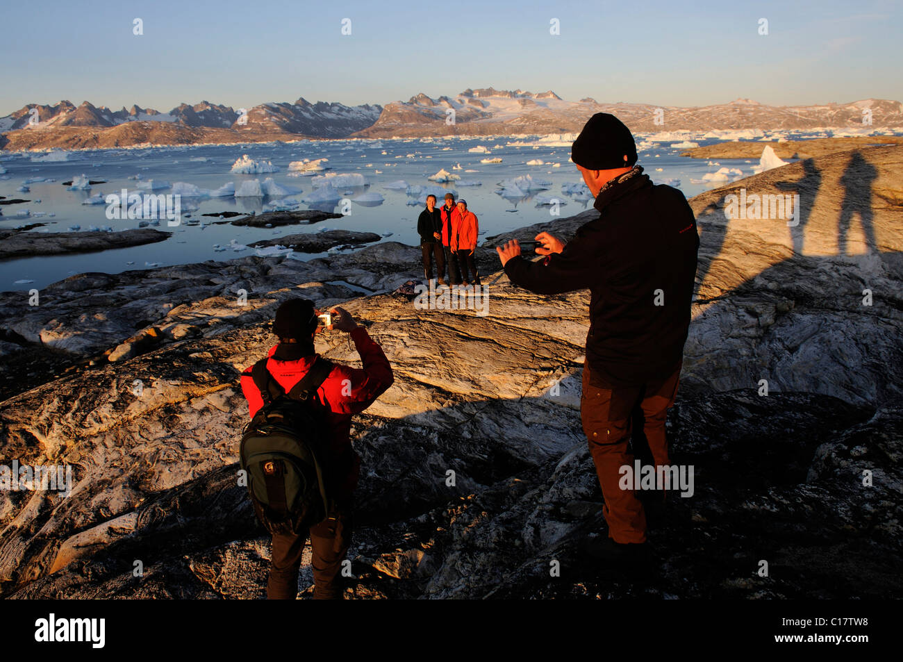 Hikers, trekking in the Sermilik-Fjord, East-Greenland, Greenland Stock Photo