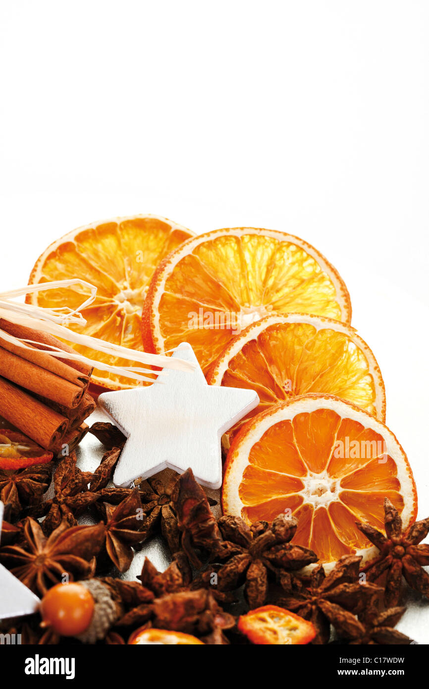 Christmas platter with decorative star, cinnamon sticks, star anise and dried orange slices Stock Photo