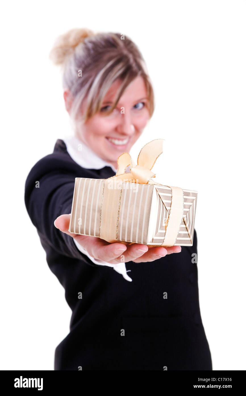 Woman wearing a costume, holding a christmas present Stock Photo - Alamy