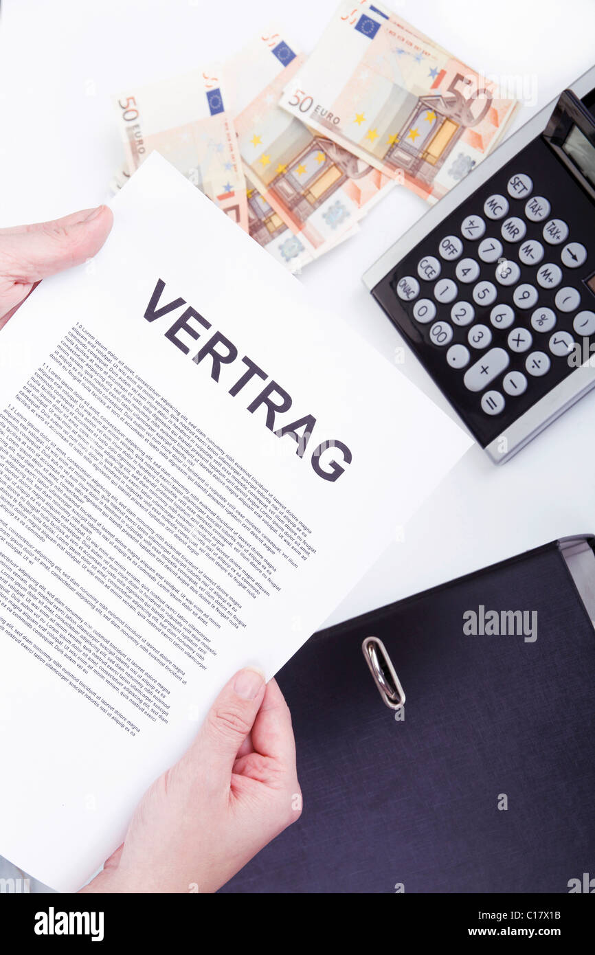 Contract, banknotes, calculator Stock Photo