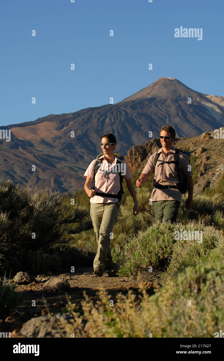 Hikers in front of Mount Teide, Teide National Park, Tenerife, Canary Islands, Spain, Europe Stock Photo