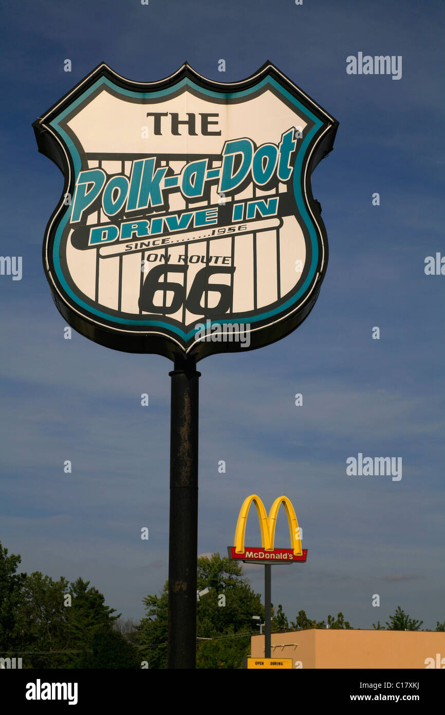 Trademarks competing, sign for the Polk-A-Dot Drive In, on Route 66, behind it a sign for McDonalds, Braidwood, Illinois, USA Stock Photo