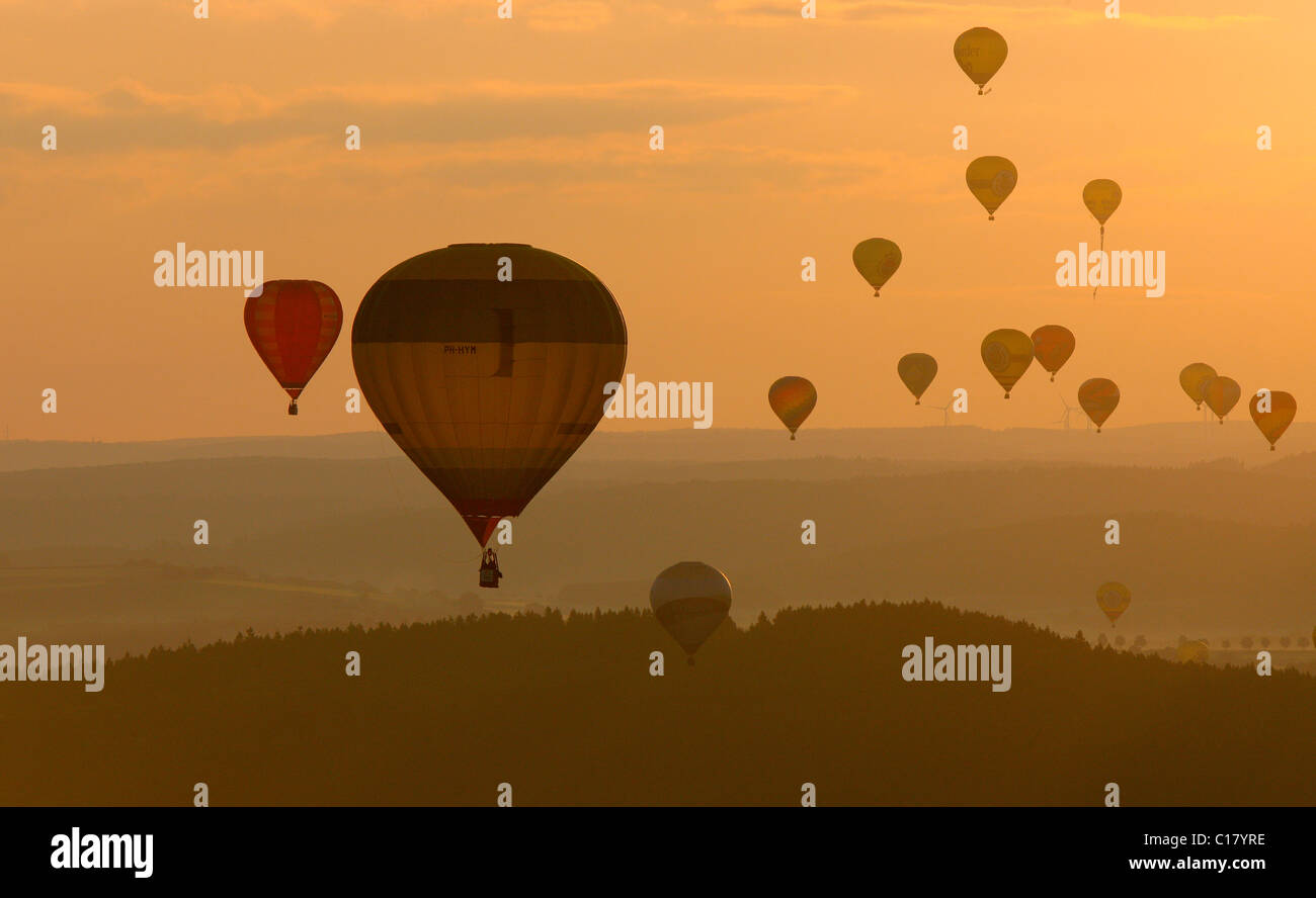 Aerial photograph, hot-air balloons, International Mongolfiade, start at the Warsteiner Brewery, sunset, Hirschberg, Warstein Stock Photo