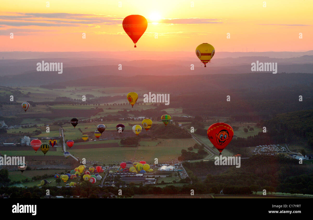 Aerial photograph, hot-air balloons, International Mogolfiade, start at the Warsteiner Brewery, sunset, Hirschberg, Warstein Stock Photo