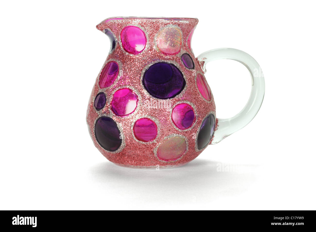 Colorful glass jug with circular patterns on white background Stock Photo