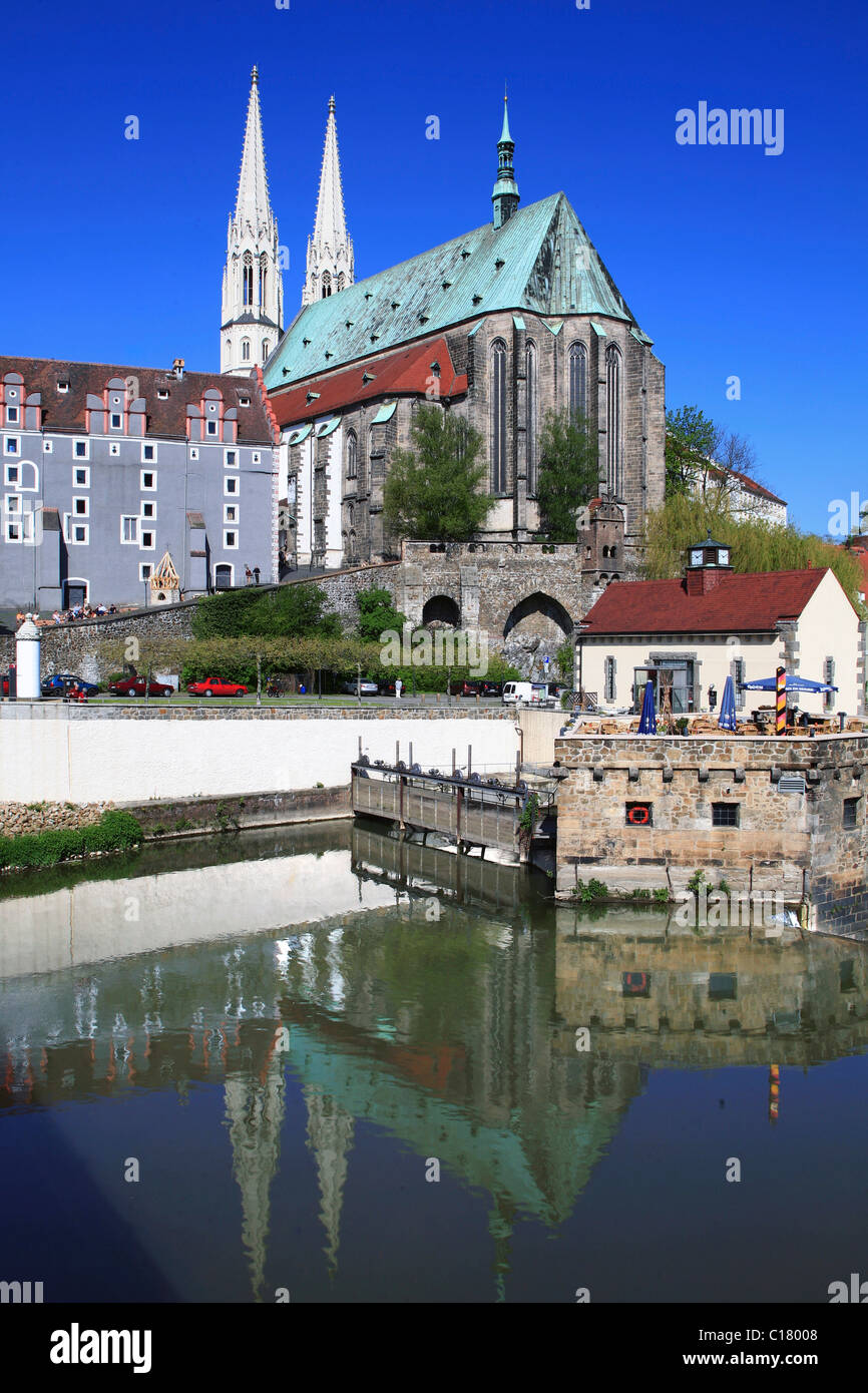 Neisse river bank with St Peters church and Weidhaus in the back, Vierradenmuehle mill on the right, Goerlitz, Saxony Stock Photo