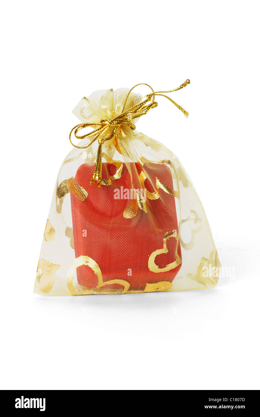 Red jewellery box in gold sachet on white background Stock Photo Alamy
