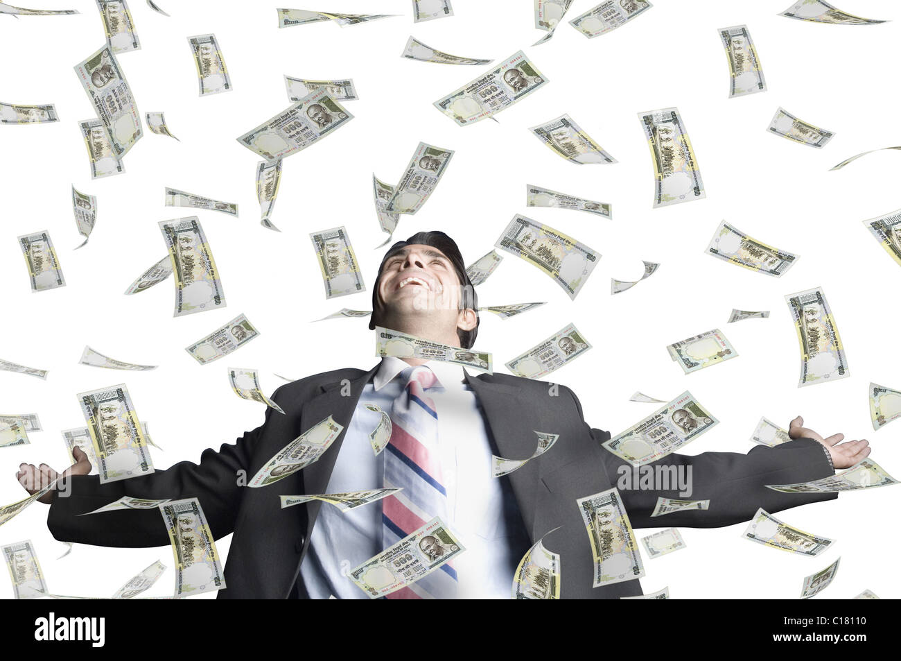 Money shower on a businessman Stock Photo