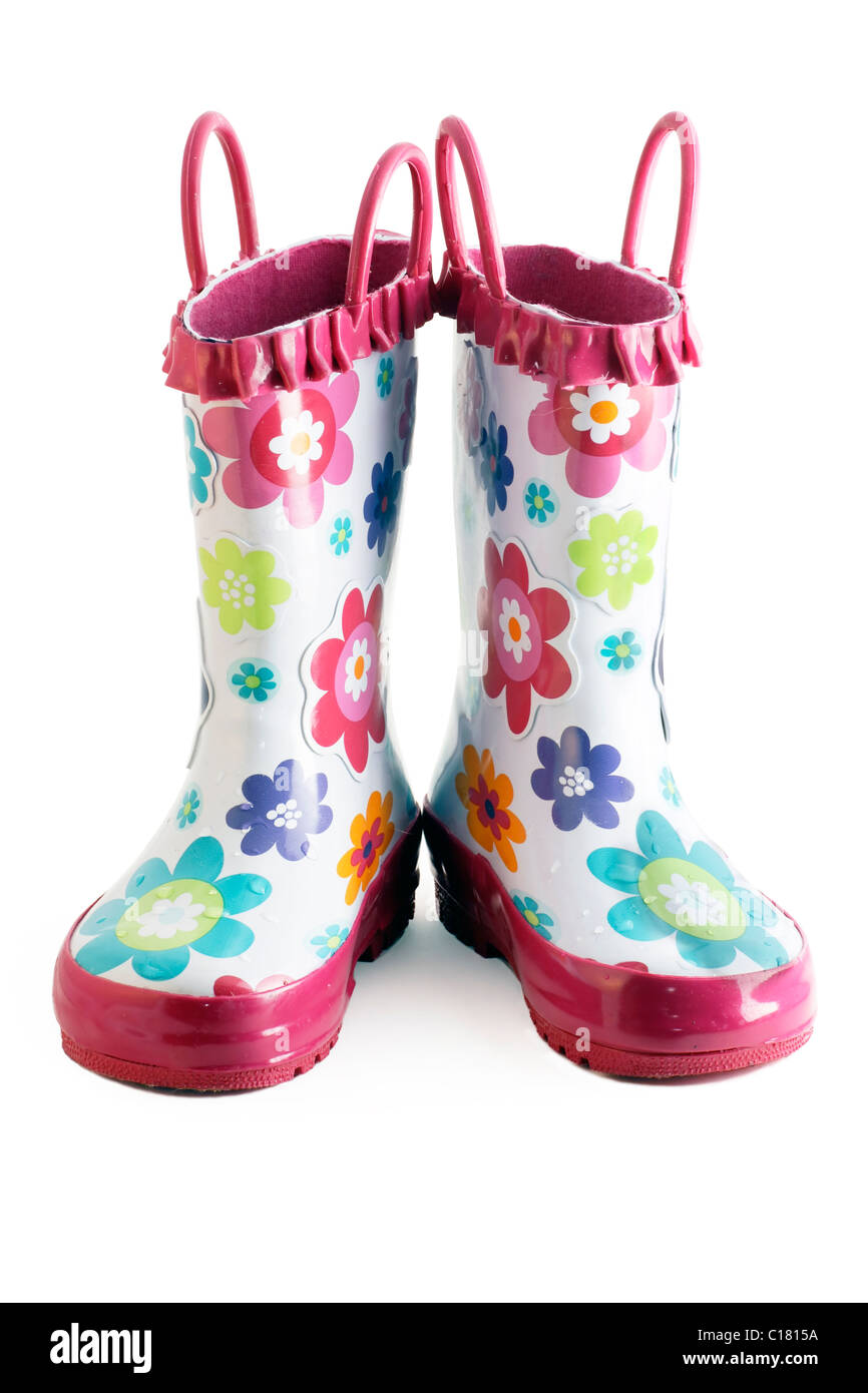 Pair of little girl's fun rain boots galoshes with water droplets on them Stock Photo