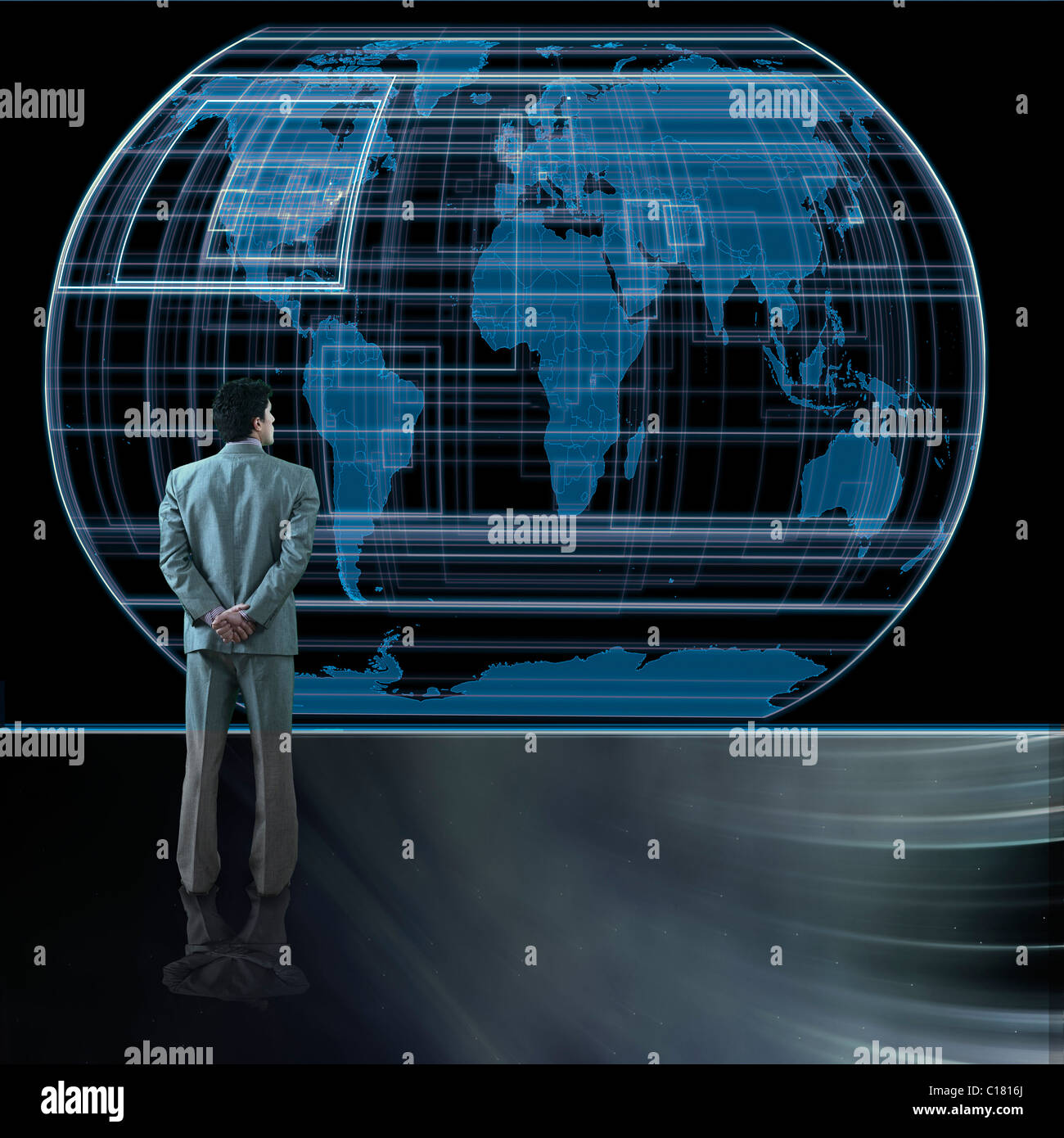 Rear view of a businessman looking at a globe Stock Photo - Alamy