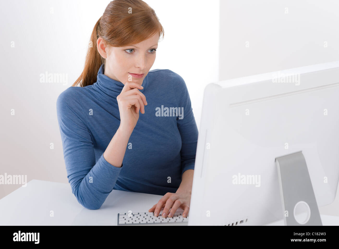 Modern office - young business woman work at computer Stock Photo - Alamy