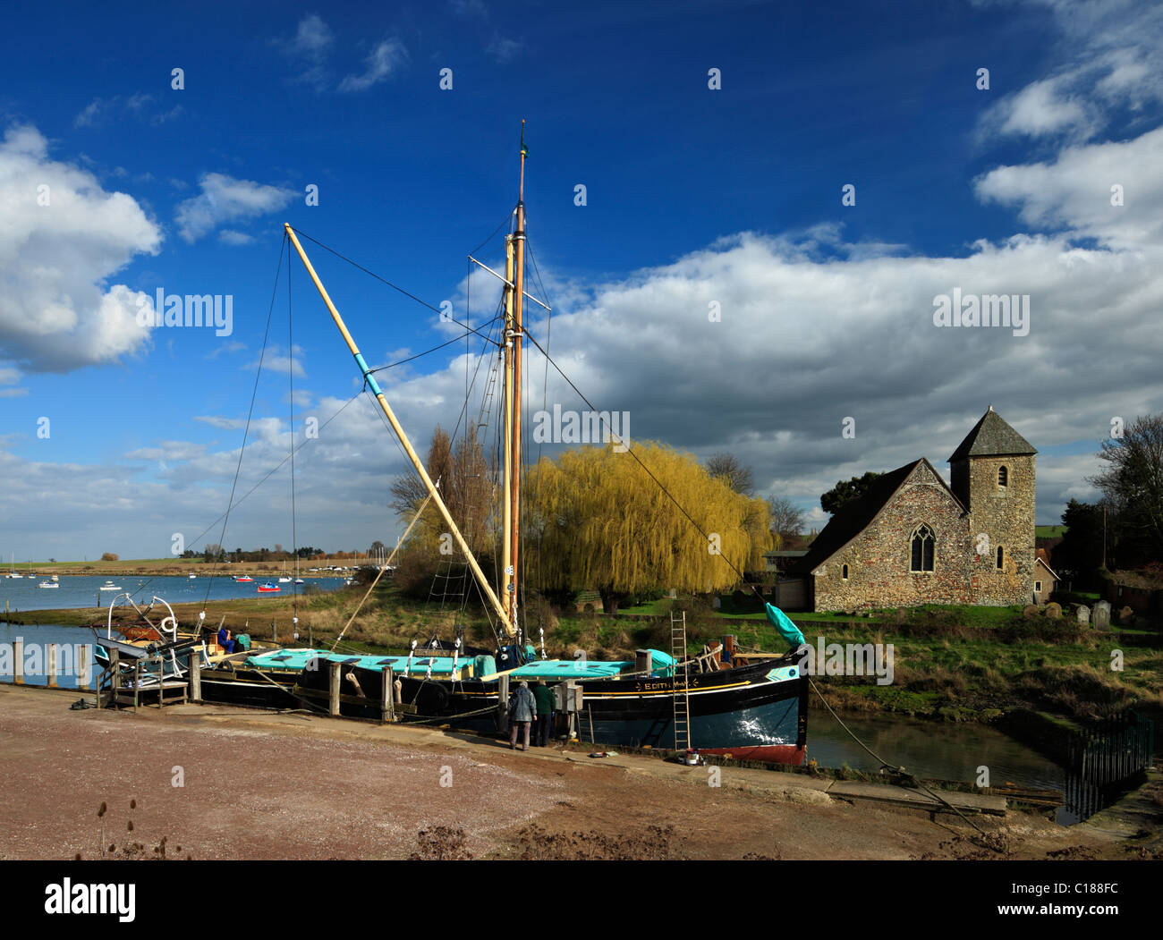 Old Thames Barge called Edith May , and the Church of St Margaret of Antioch Lower Halstow. Stock Photo