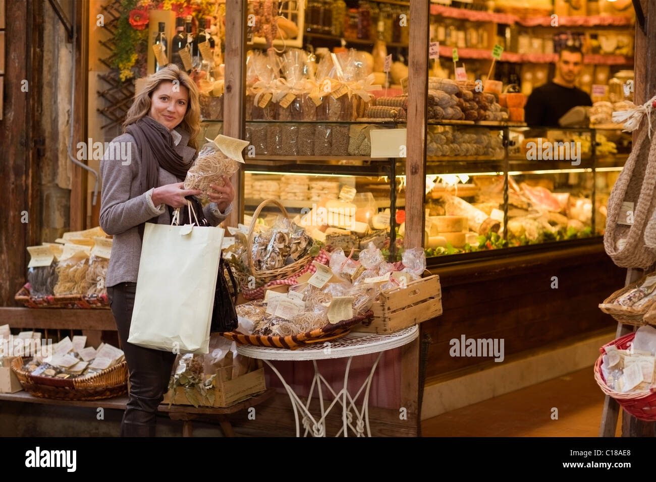 Woman in front of deli Stock Photo