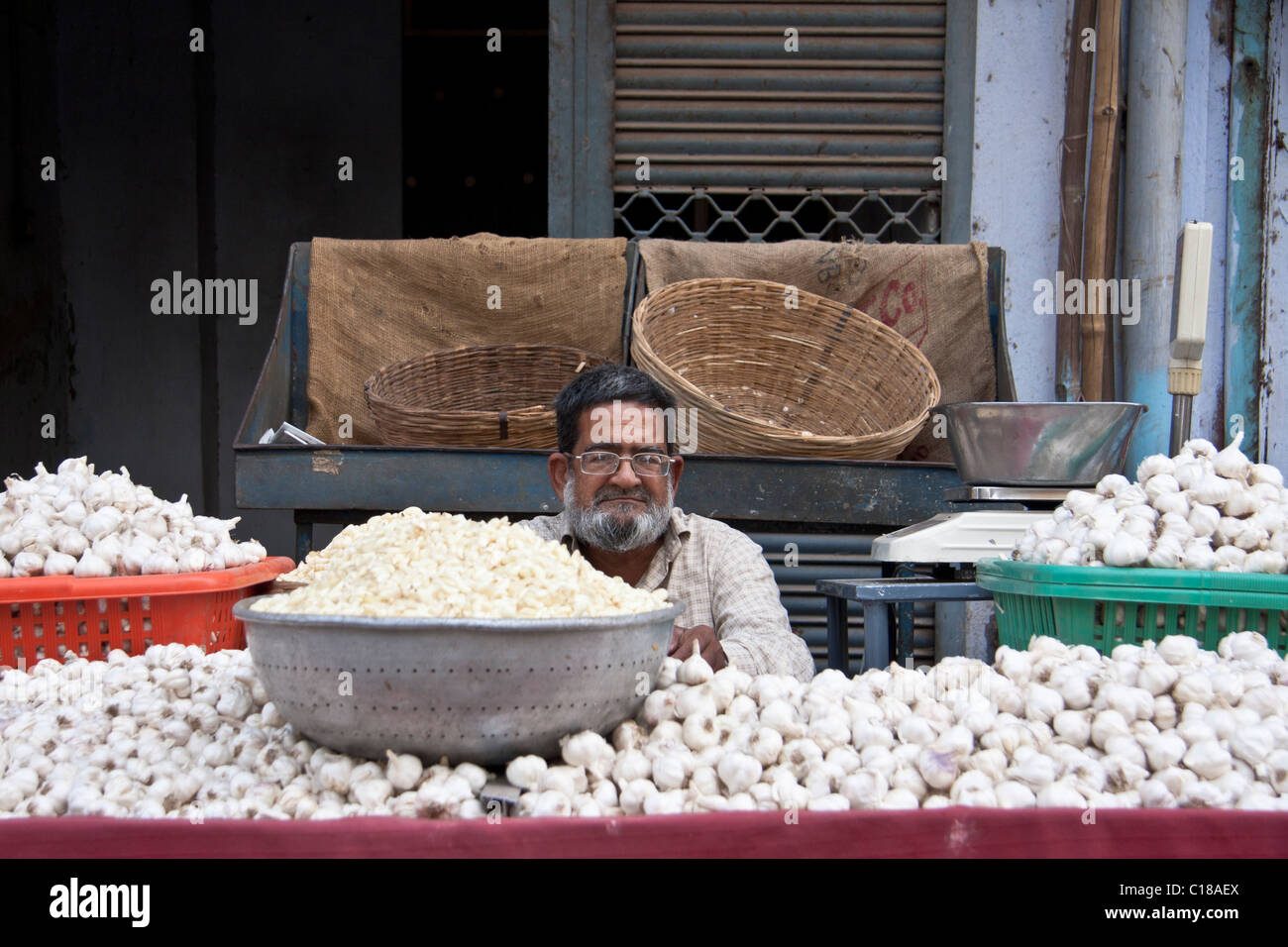 Garlic stall in an Indian  vegetable market. Stock Photo