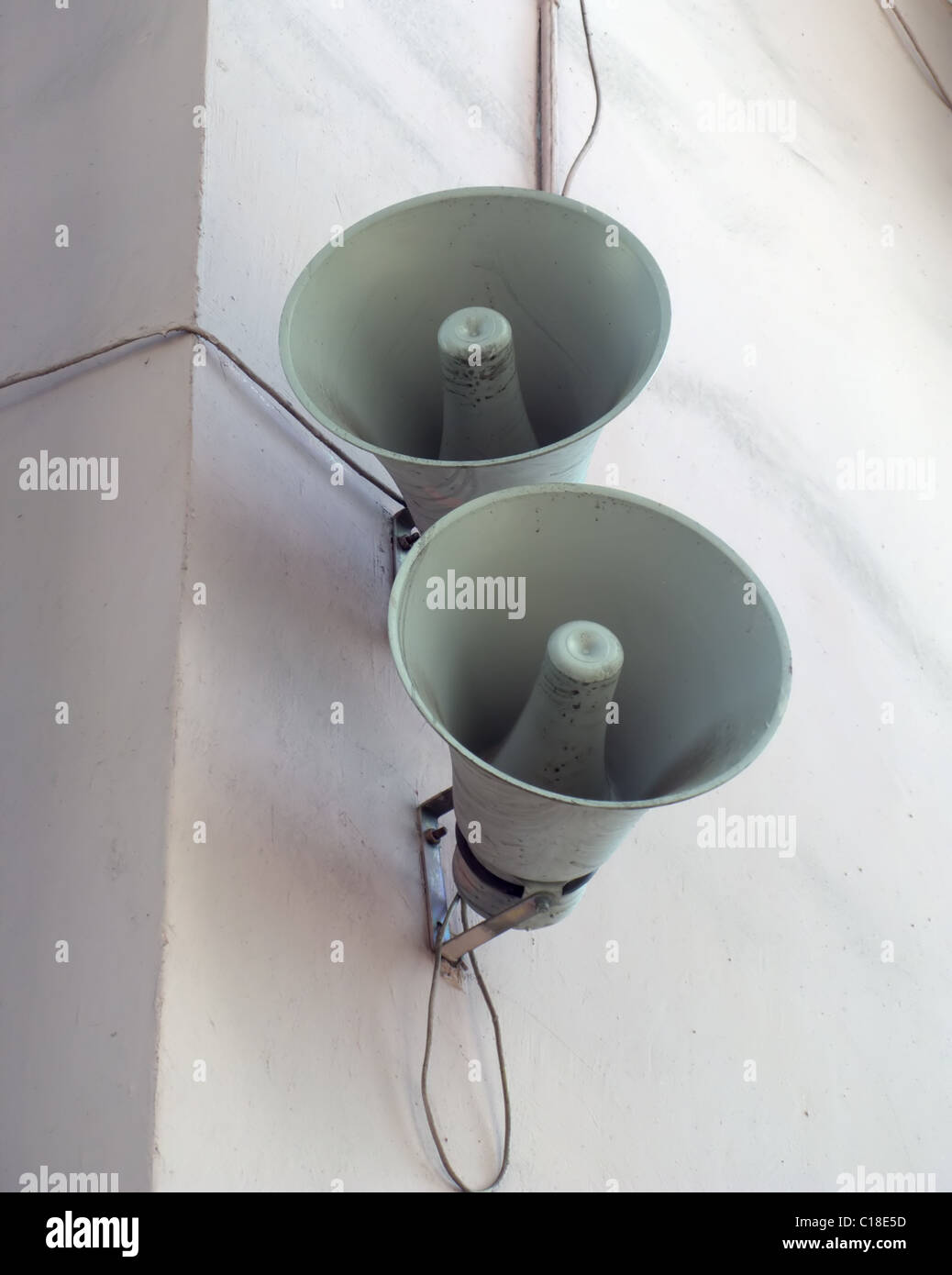 Two speakers are installed on a wall of a building Stock Photo