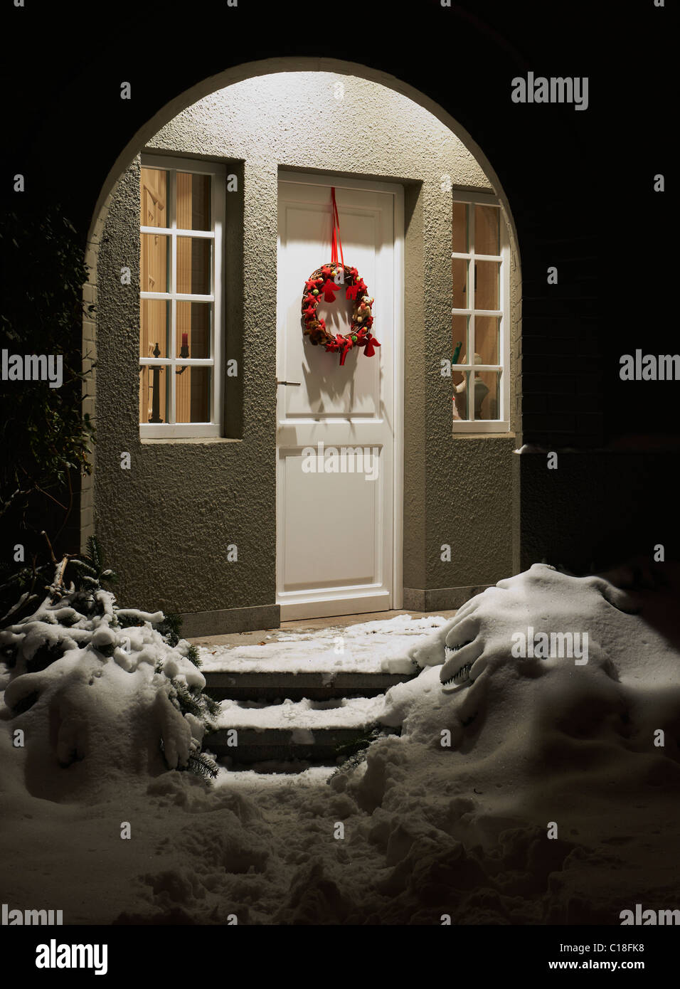 Entrance of a house at Christmas eve Stock Photo