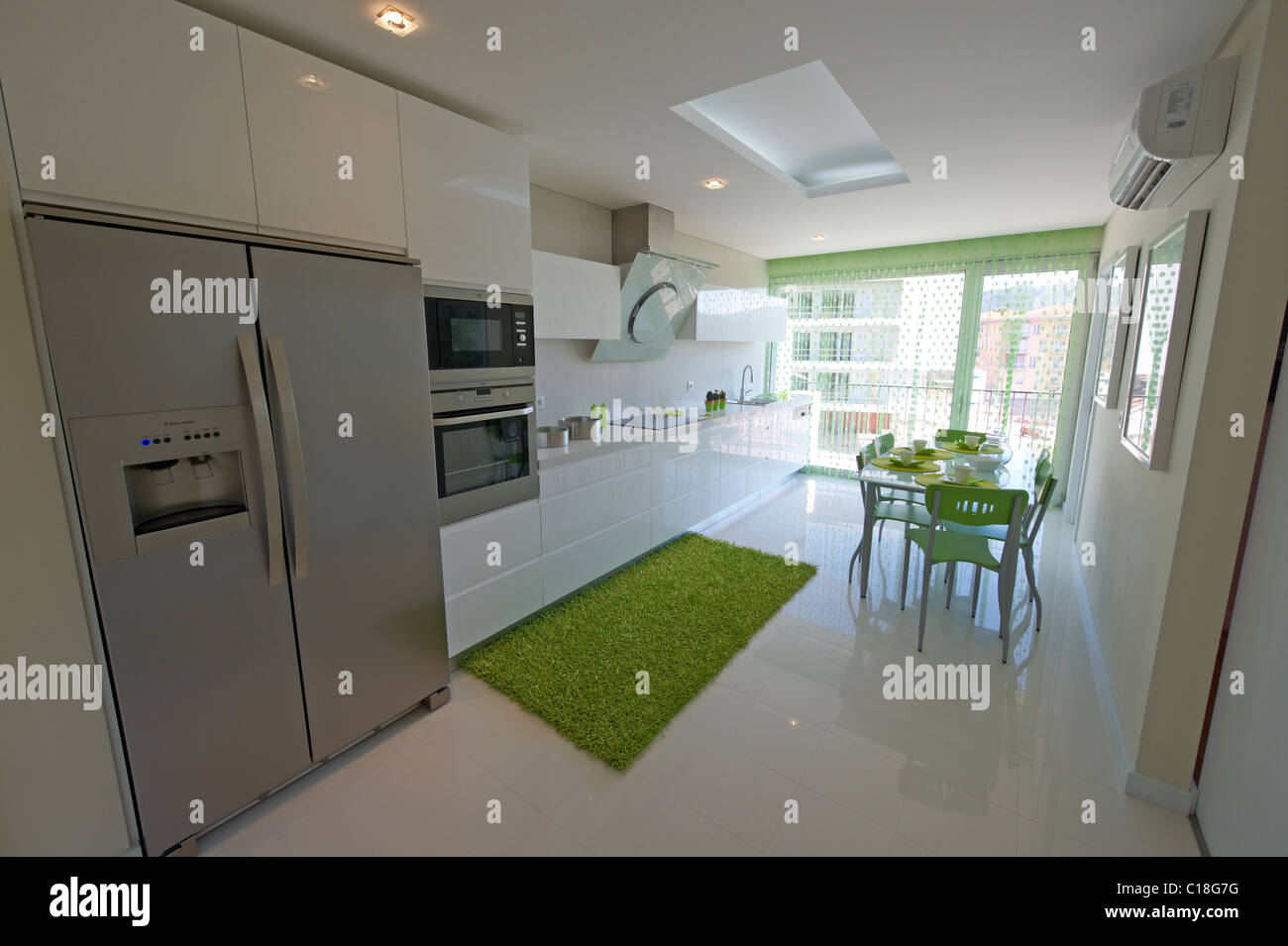 Modern kitchen with green decoration Stock Photo