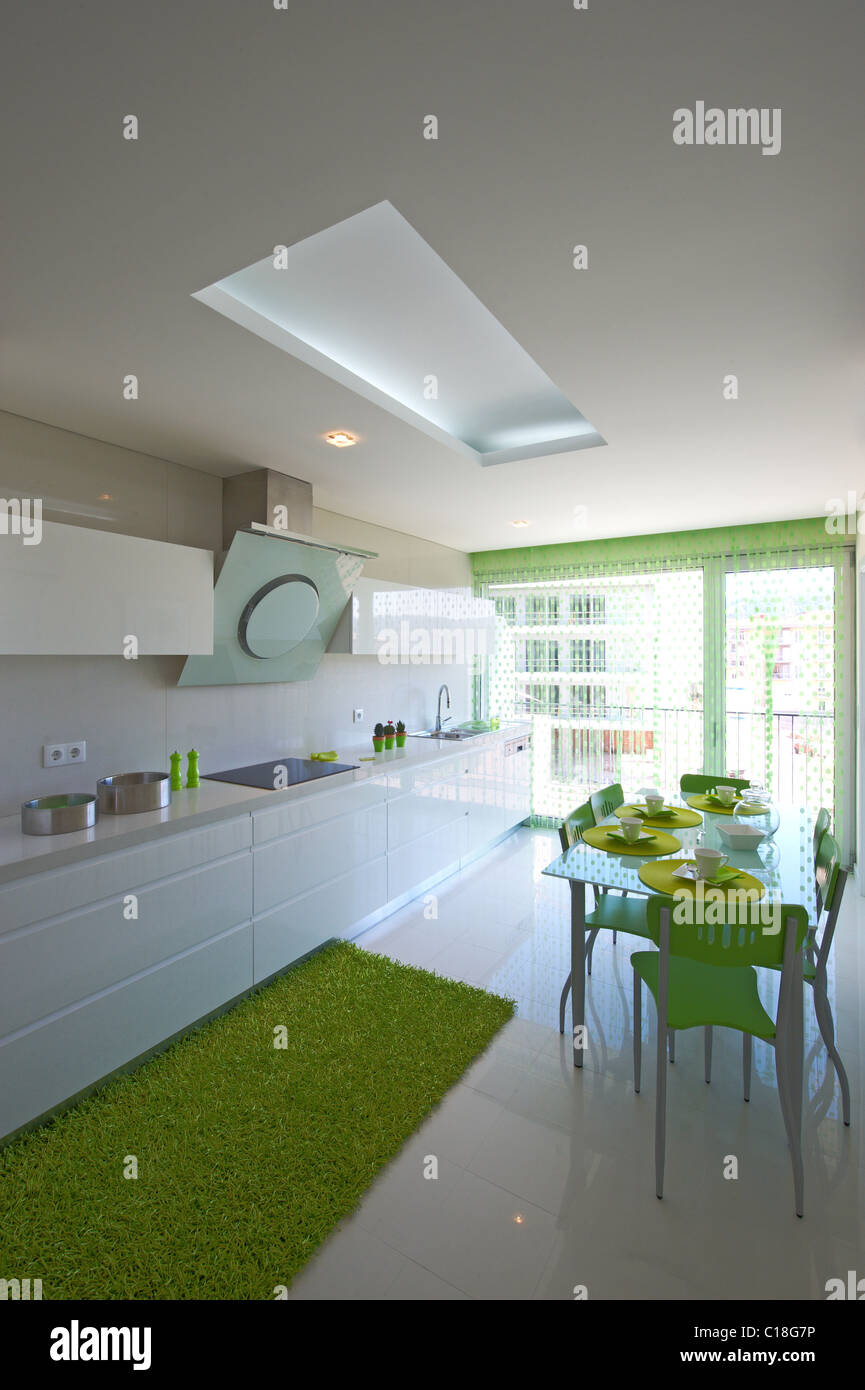Modern kitchen with green decoration Stock Photo
