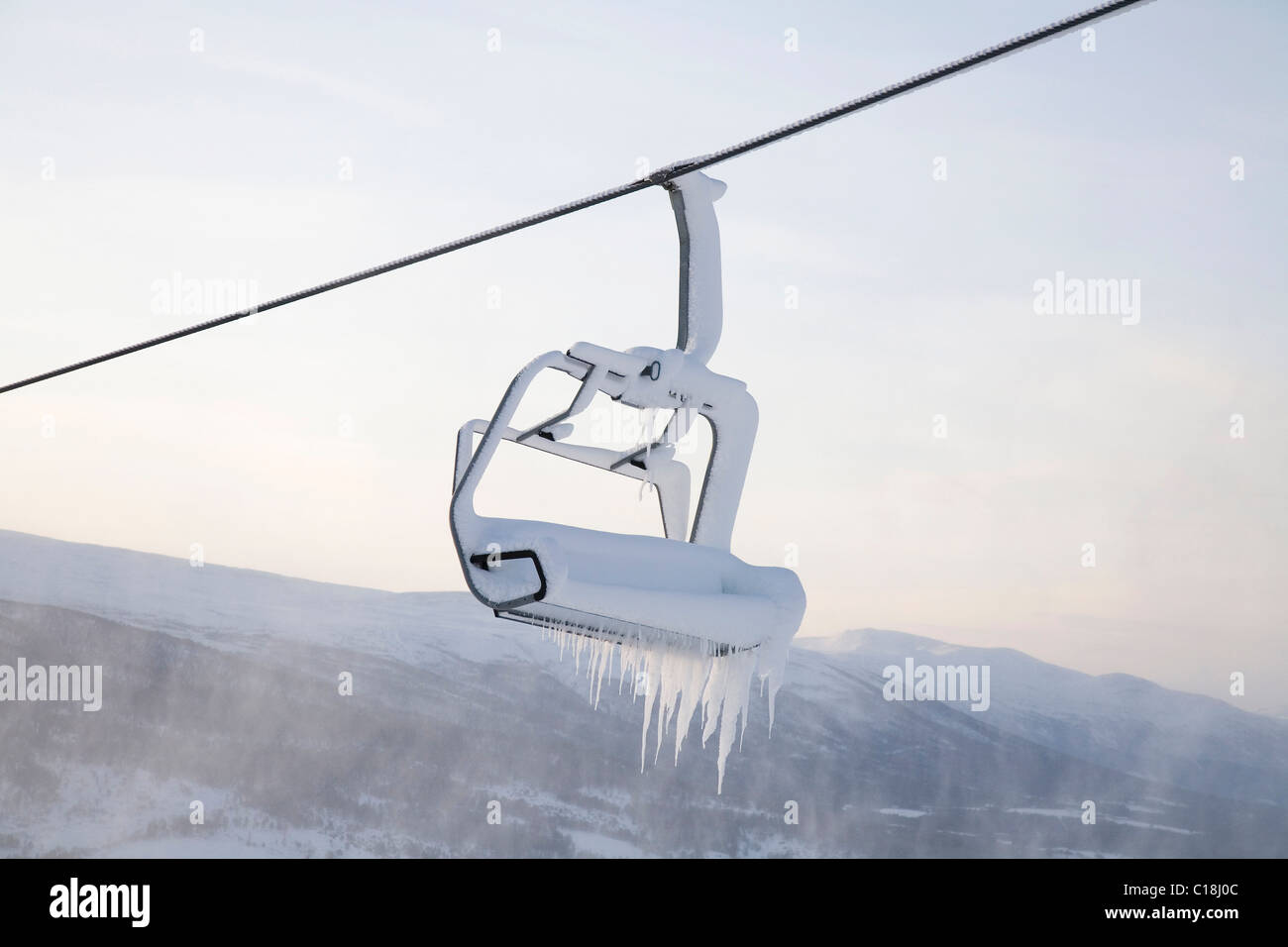 Chair lift full of snow and ice Stock Photo