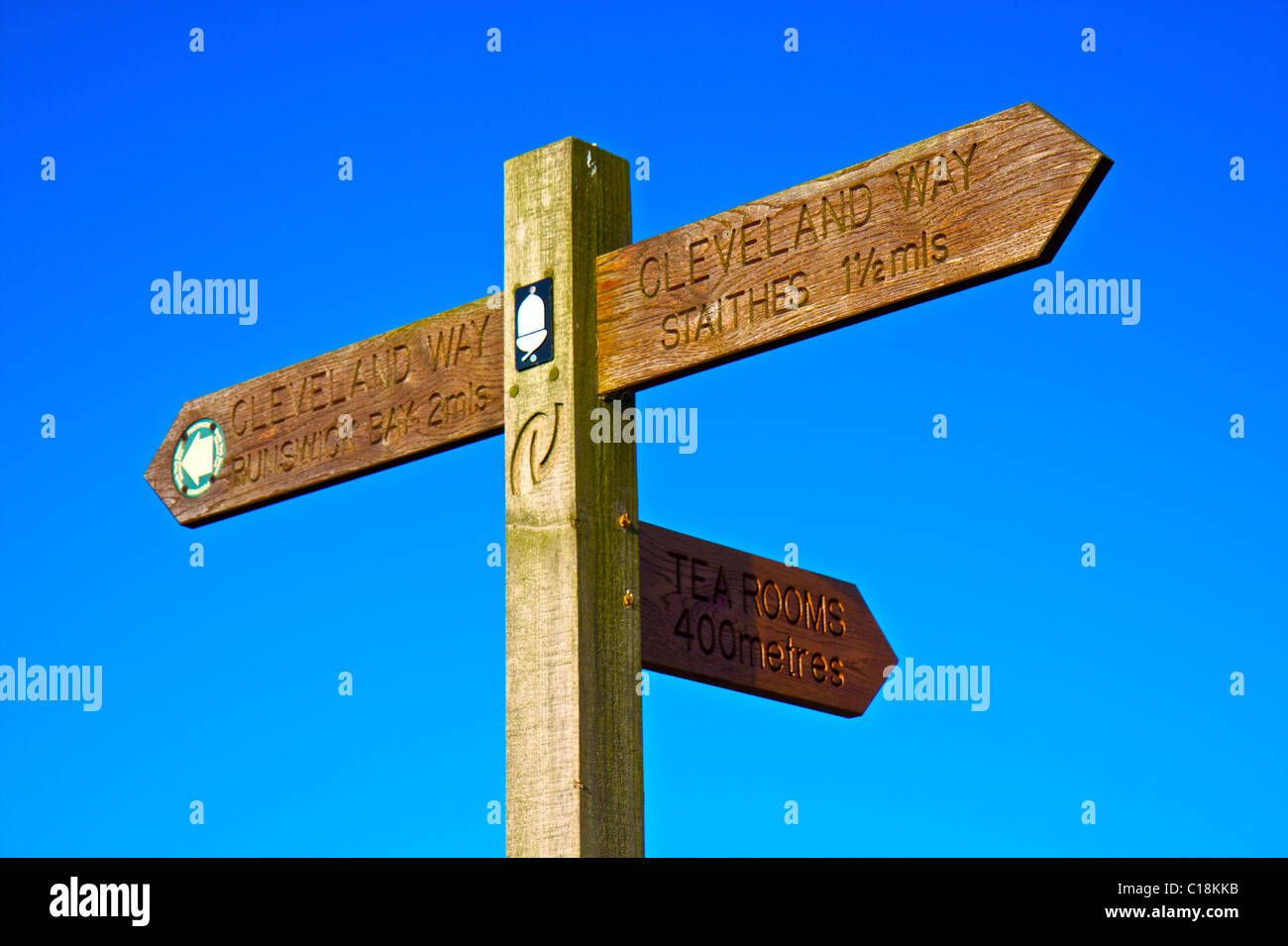 Wooden sign post set against a blue sky, located along the Cleveland Way, North Yorkshire, England UK Stock Photo